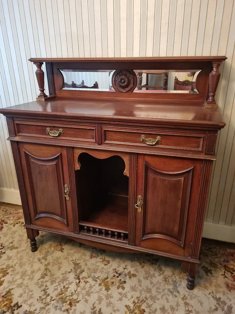 Antique mahogany sideboard with a mirrored back