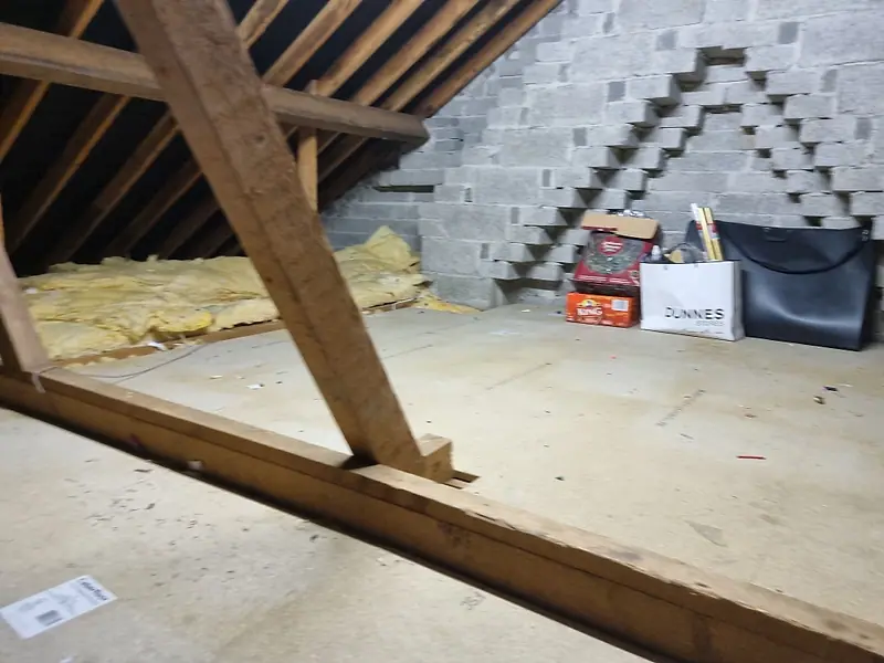 The same attic floor cleared back to the chipboard deck