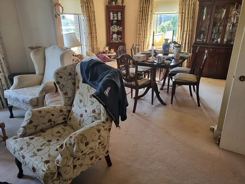Furnished living and dining room before an estate clearance