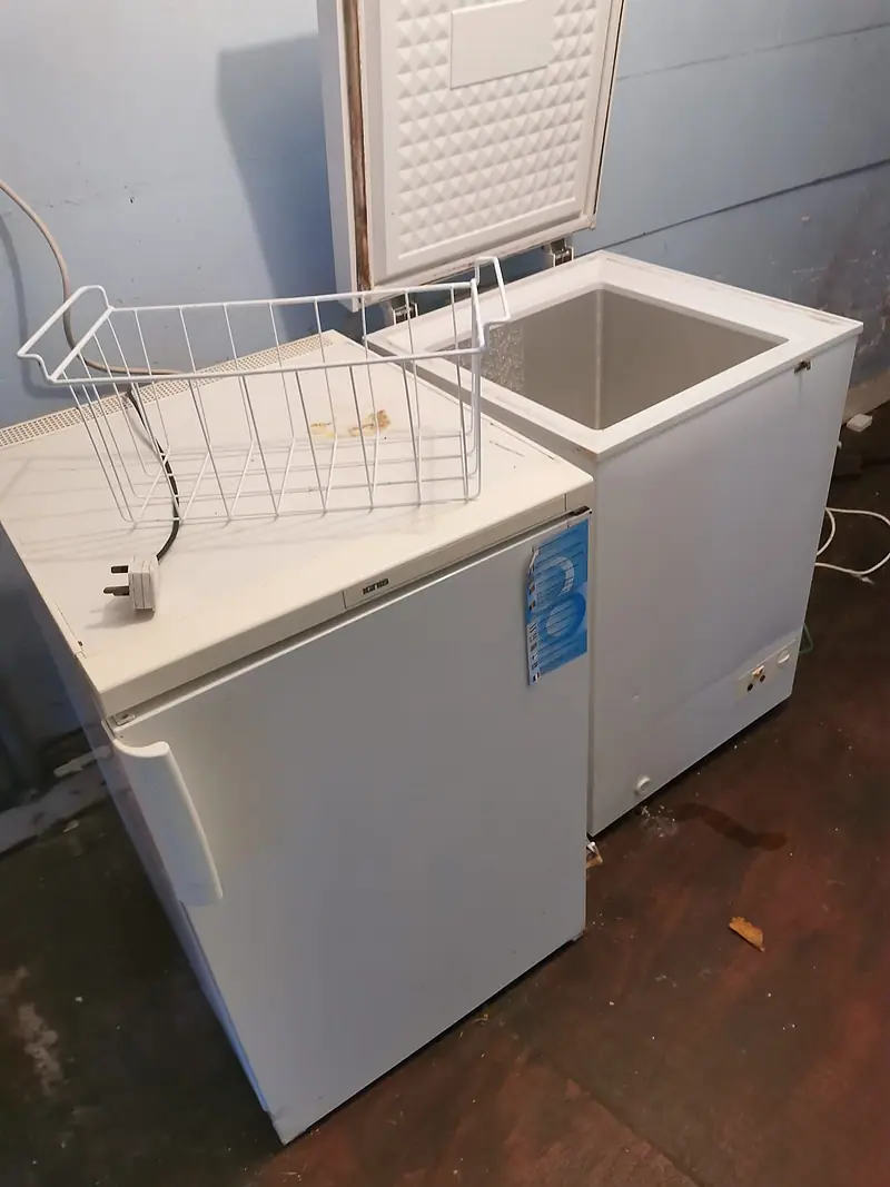 Chest freezer and wire baskets ready for collection and recycling