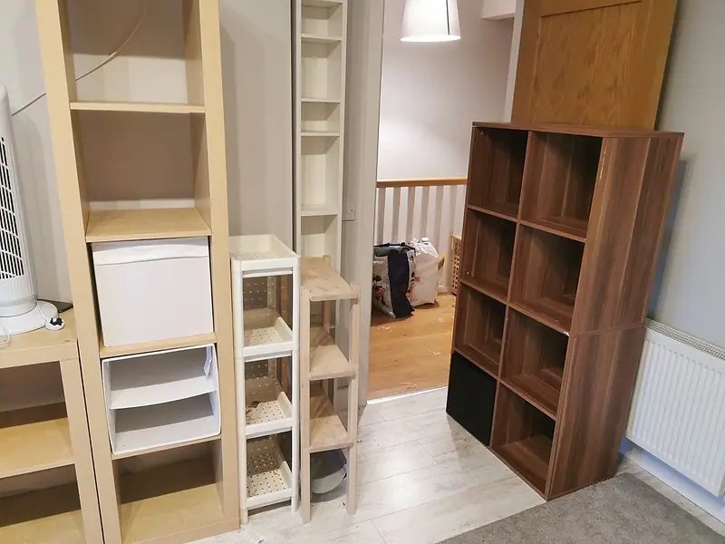 Empty wooden shelving units ready to be dismantled and taken away