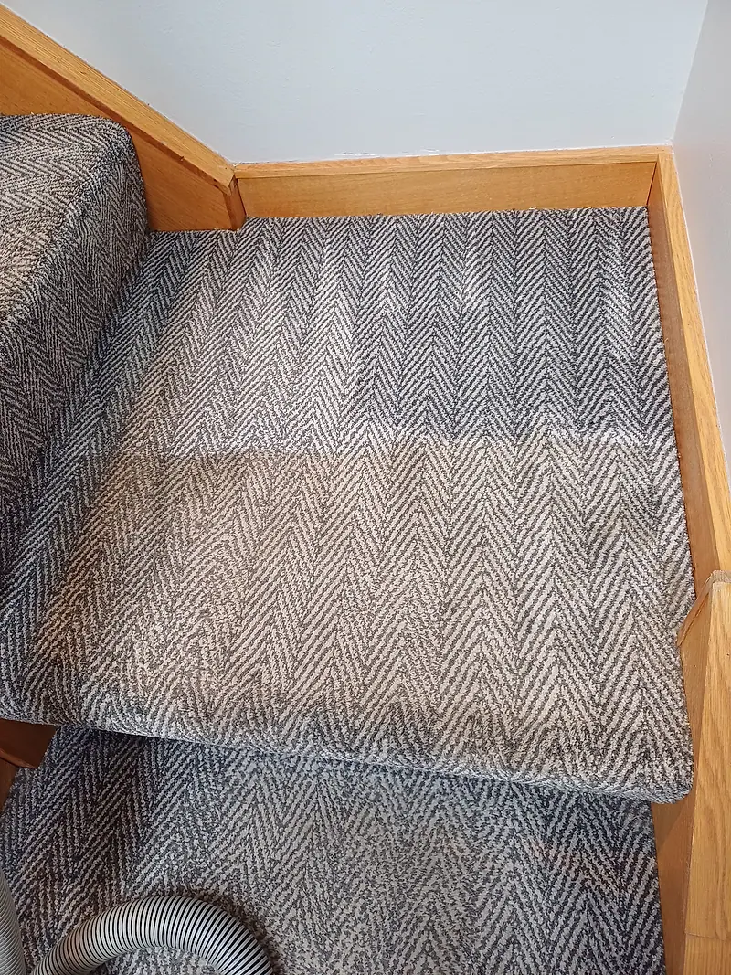 Herringbone landing carpet with a clear line between the washed and unwashed sections