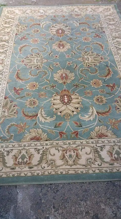 The same rug after cleaning, the stain gone and the pattern clear