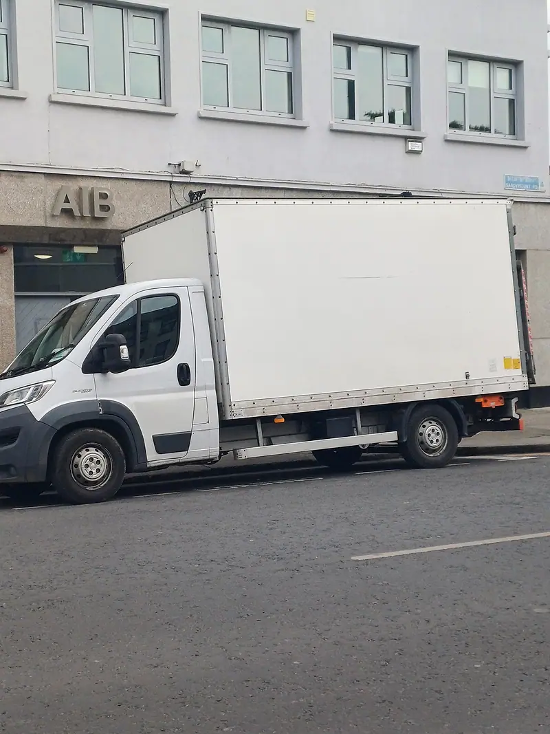 White Luton box van used for Spotless house clearances, parked on a Dublin street